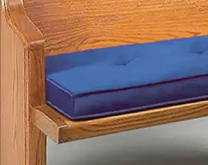 A mockup of a box cushion on a pew